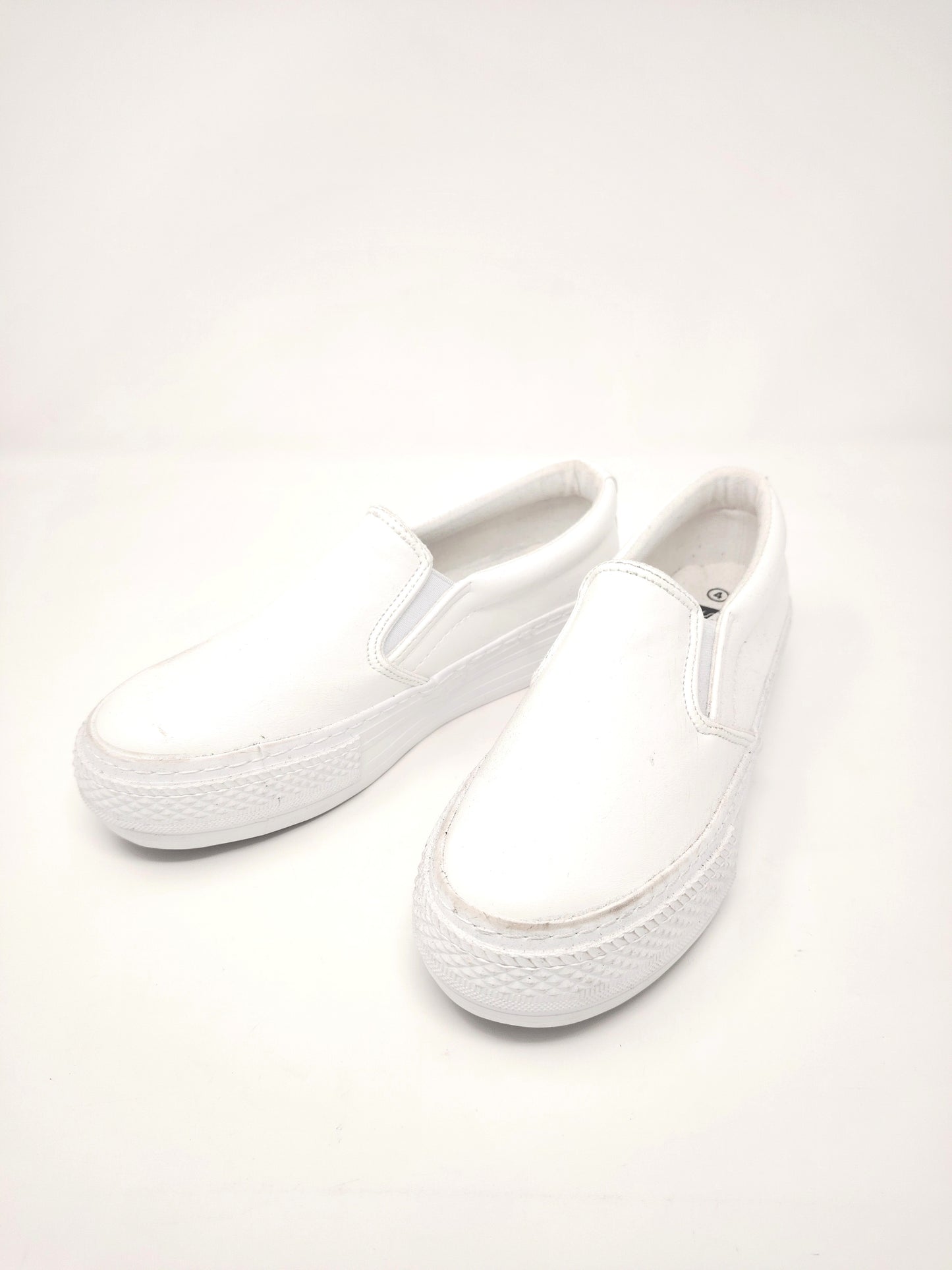 Ladies white slip-on shoes